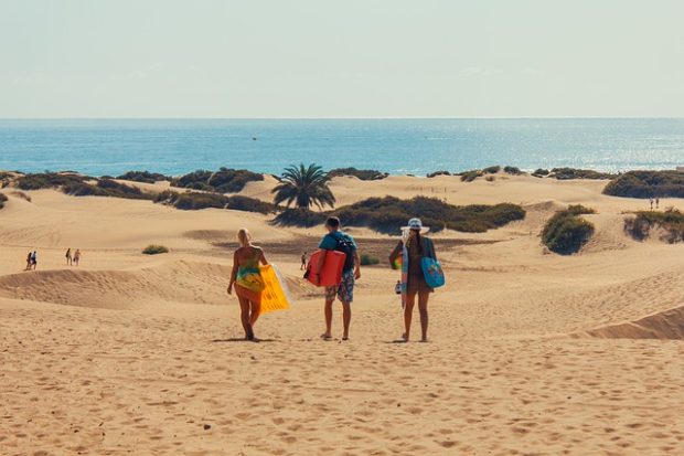 People walking on dunes