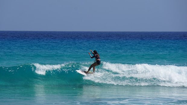 Girl practicing surfing