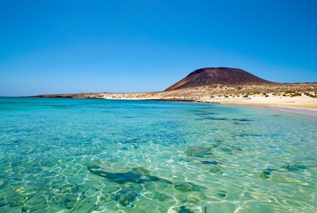 landscape of the beach and a volcano