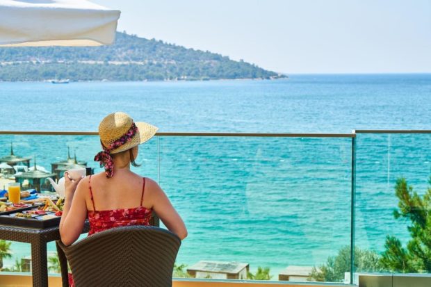 woman having a drink in an only adults hotel