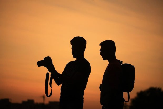 Boys making photos on a journey