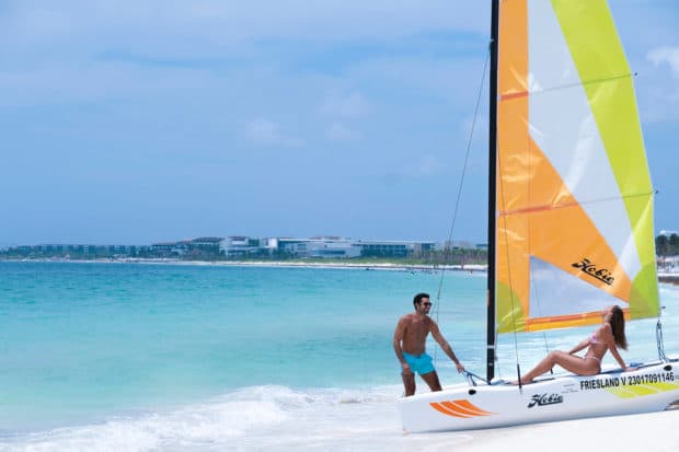 Woman and man on a boat in mexican caribbean