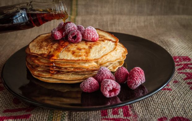 Breakfast with pancakes and raspberries