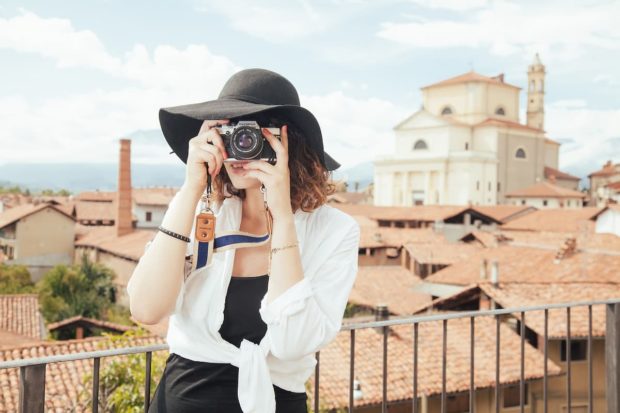 Woman taking photo while travelling