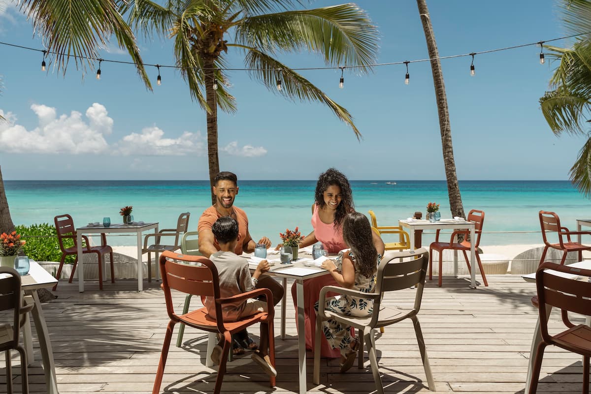 family dining at the beach