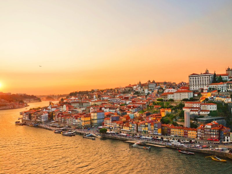 Magnificent sunset over the Porto city center and the Douro river, Portugal. Dom Luis I Bridge is a popular tourist spot as it offers such a beautiful view over the area.