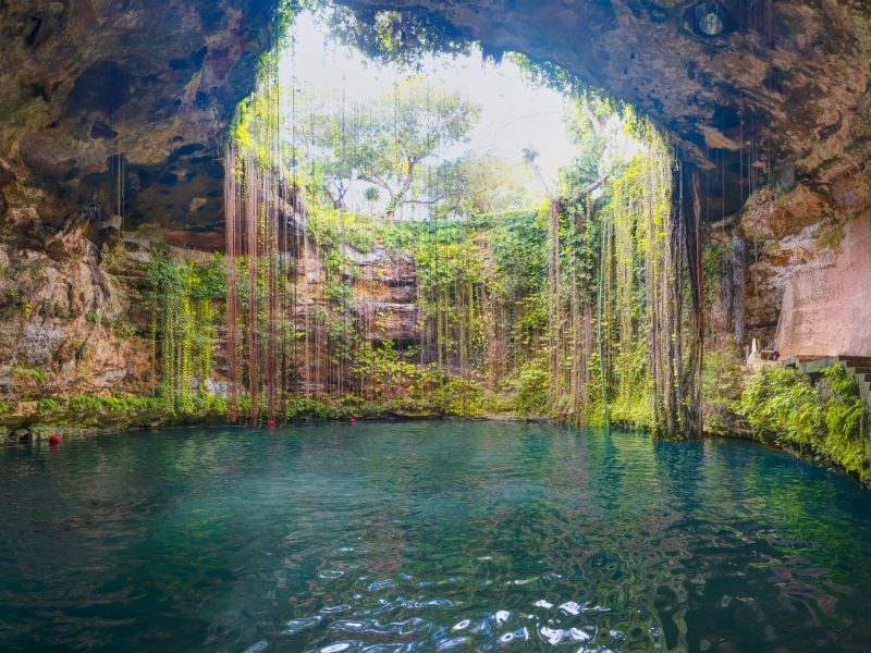 Ik-Kil Cenote - Lovely cenote in Yucatan Peninsulla with transparent waters and hanging roots. Chichen Itza, Mexico
